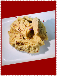 A picture of Cinnamon flavored kalakand /milk cake in microwave.
