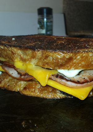 A picture of Ultimate Grilled ham and cheese sandwich with Bacon.