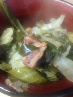 A picture of Greens and cabbage.