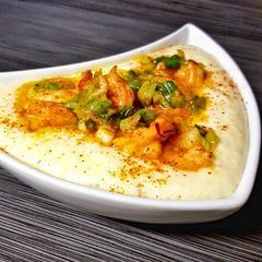 A picture of Shrimp and Creamy Queso Grits.