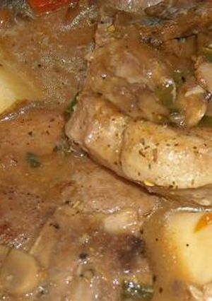 A picture of PORK CHOP ALL IN ONE SKILLET DINNER.
