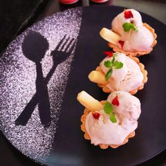 Date palm jaggery tart with date palm jaggery ice cream A picture of Date palm jaggery tart with date palm jaggery ice cream.
