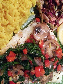 A picture of Baked Cod with a vegetable sautee topping.