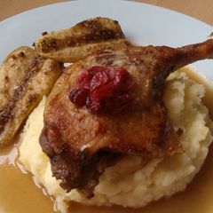 A picture of Vickys Seared Duck Legs with Pear and Cranberry Gravy.