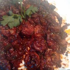 A picture of Shrimp scampi in red wine tomatino.