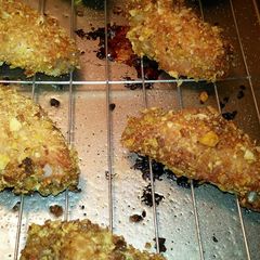 A picture of Cereal coated baked chicken.