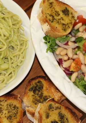 A picture of PESTO PASTA and BEAN SALAD with GARLIC BREAD.