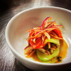 A picture of Marinated Cucumbers,Tomatoes and Red Onions in House Dressing.ti.