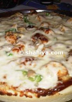 A picture of BBQ Chicken Pizza with a Chewy Pizza Crust.