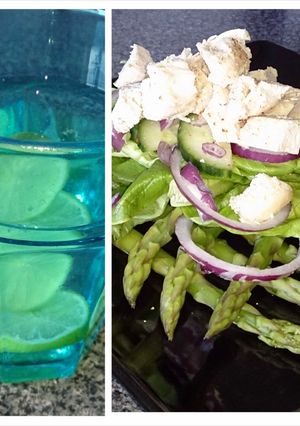 A picture of chicken and asparagus salad, lime water.