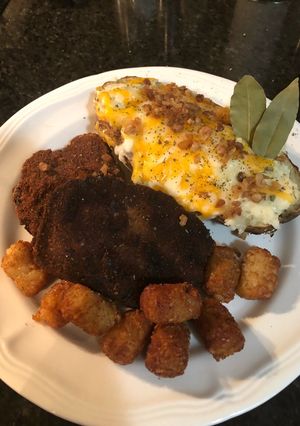 A picture of Leftover meatloaf and baked potato.