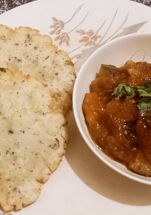 A picture of Khatta Meeta Kaddu (pumpkin) with Samak poori.
