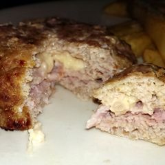 A picture of Sophie's turkey, bacon and cheese burger juicy Lucy style burger.