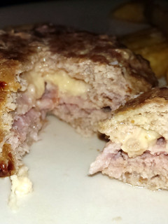 A picture of Sophie's turkey, bacon and cheese burger juicy Lucy style burger.