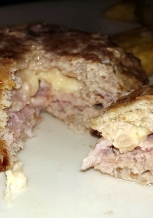 A picture of Sophie's turkey, bacon and cheese burger juicy Lucy style burger.