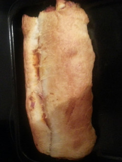 A picture of Tomato cheese and olive log.
