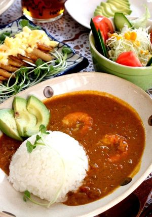 A picture of Tomato Curry with Prawns and Coconut.