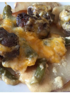 A picture of Cheesy Scalloped Red Potatoes With Hamburger And Fresh Green Beans.