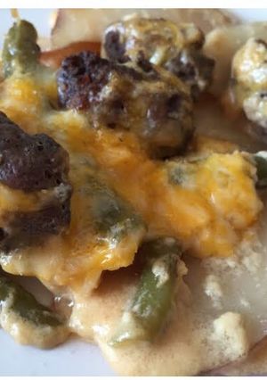 A picture of Cheesy Scalloped Red Potatoes With Hamburger And Fresh Green Beans.