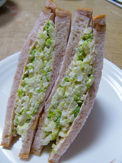 A picture of Sandwich with Lots of Chinese Cabbage.