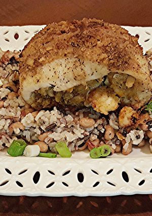 A picture of Cajun Stuffed Catfish on Creole Wild Rice.