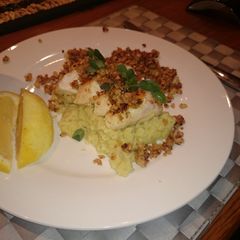 A picture of Chicken with leek puree and macadamia nuts.