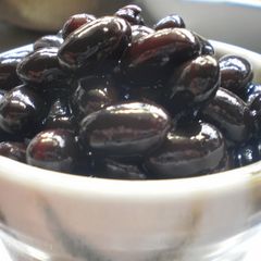 A picture of Plump and Juicy 'Kuromame' Simmered Black Soy Beans.