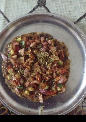 A picture of Paratha Pizza(or Paratha With Salad Topping).