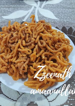 A picture of Rice Flour Murukku with Carom and Sesame Seeds.