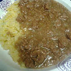 A picture of Meat gravy with cauliflower rice.