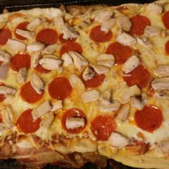 A picture of Bacon crusted pizza.