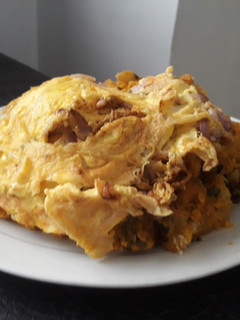 A picture of Porriage potatoes with fried egg.
