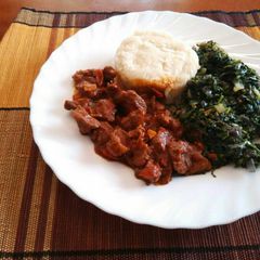 A picture of Ugali, Managu(African nightshade) and beef.