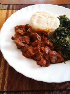 A picture of Ugali, Managu(African nightshade) and beef.