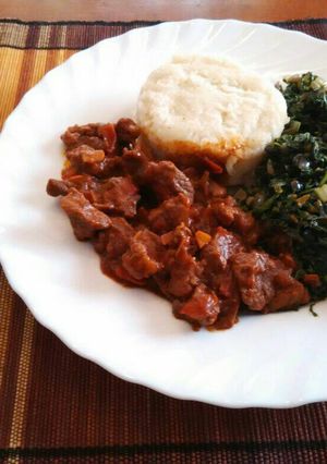 A picture of Ugali, Managu(African nightshade) and beef.