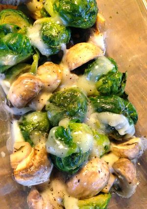 A picture of Brussels Sprouts and Mushrooms with Cheese.