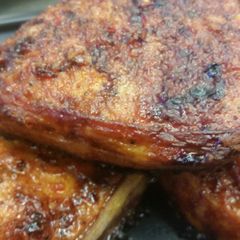 A picture of Bacon Wrapped Sriracha Pork Chops.