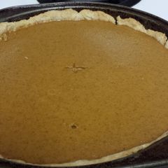A picture of Homemade pumpkin pie and crust.