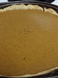 A picture of Homemade pumpkin pie and crust.