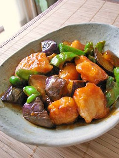 A picture of Eggplant, Bell peppers and Chicken with Sweet and Sour Sauce.