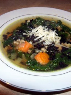 A picture of Turkey and kale soup with black rice.