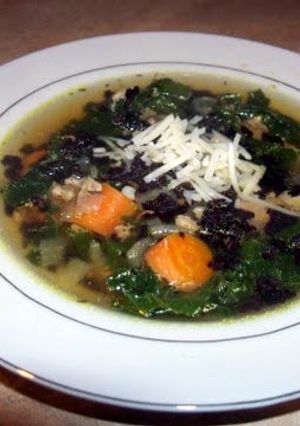 A picture of Turkey and kale soup with black rice.