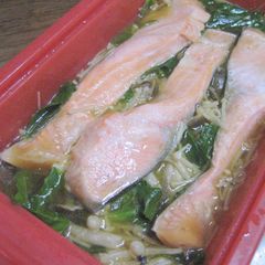 A picture of Easy Microwave-Steamed Salmon and Mushrooms in a Silicone Steamer.