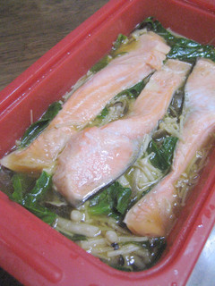 A picture of Easy Microwave-Steamed Salmon and Mushrooms in a Silicone Steamer.