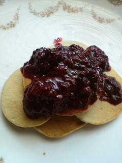 A picture of Momma's blueberry pancakes and homemade triple berry syrup.
