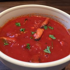 A picture of Smoked Mussels In Tomato Soup.