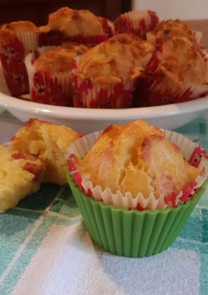 A picture of Cheesy muffins with salami (or ham).