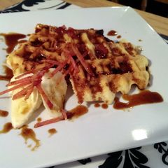 A picture of Bacon Banana Beer Gluten Free waffles & Bourbon Brown Butter Caramel Sauce.