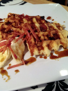 A picture of Bacon Banana Beer Gluten Free waffles & Bourbon Brown Butter Caramel Sauce.