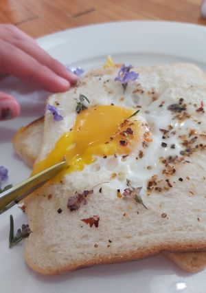 A picture of Savoury Rosemary Flower Egg in a Hole.